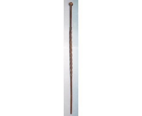 An early 20th century hard wood walking stick. The stick having knob handles with barley twisted top shaft and tapered lower 