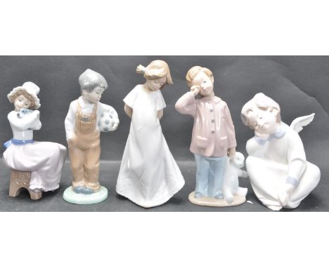 A collection of four 20th century Nao children figurines to include a boy holding a football, another holding a teddy bear, a