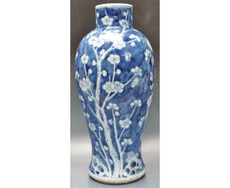 A 20th century&nbsp; Chinese Oriental prunus vase of tapering form. Kangxi 4 character mark to the base. Measures 32cm high. 