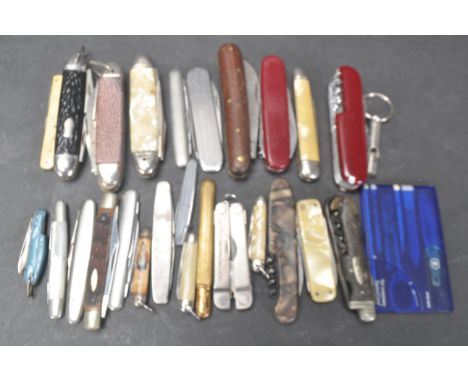 A collection of vintage 20th century pen knives comprising of a Swiss Army style pen knife, Leatherman Micra knife, a wood ef