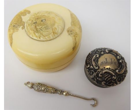 Japanese Meiji period ivory box and cover decorated with Lions D6.5cm, Edwardian silver embossed lid and silver button hook (