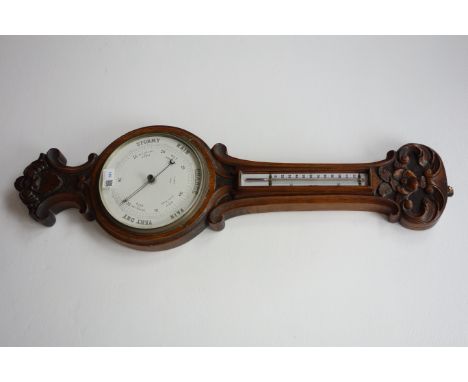 Edwardian carved oak aneroid barometer with thermometer, circular dial signed R.Smith, York, H83cm
