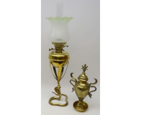 Early 20th century brass oil lamp with frosted glass shade supported by Cobra Snake cast base, H76cm and an Eastern brass two