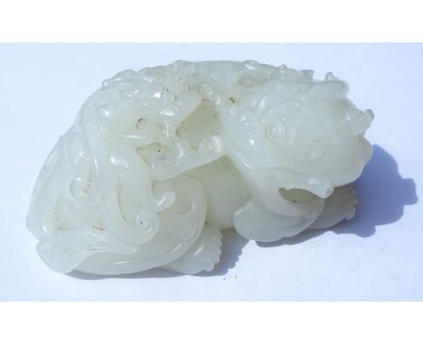 Chinese Mutton Fat Jade carving of a recumbent Dog of Fo with Cub, L7.5cm, H3.2cm x D4.5cm  