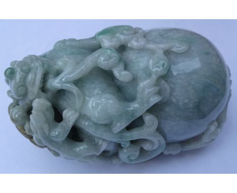 Chinese carved Burmese Jade model of a Dog of Fo with cub, perched on ball amongst scrolling foliage, L8cm 