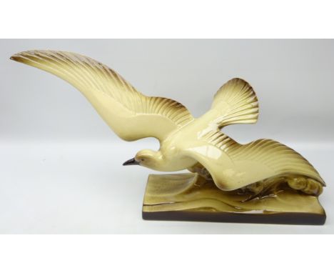Art Deco pottery model of a seagull riding a wave, L67cm approx