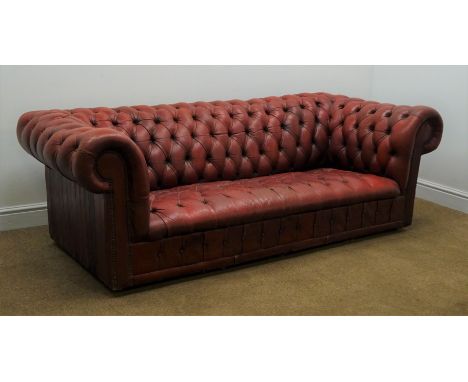 Vintage Chesterfield three seat sofa, upholstered in deeply buttoned oxblood red leather, W203cm