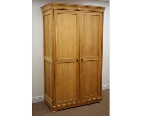 Solid light oak double wardrobe, two panelled doors enclosing fitted interior, W118cm, H200cm, D60cm