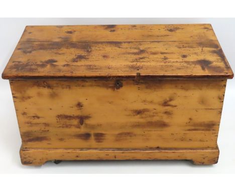 An antique pine trunk, 845mm wide x 440mm deep x 488mm high