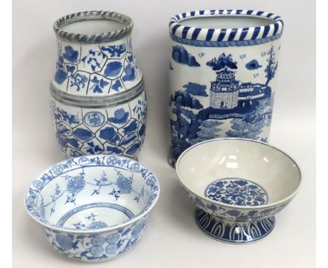 Two reproduction Oriental style blue & white stick stands, each approx. 430mm tall, twinned with two similar Oriental blue & 