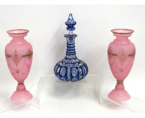 A pair of decorative pink 19thC. glass vases 295mm tall, twinned with an antique Bohemian style overlay glass decanter, some 