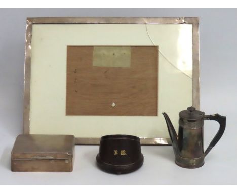 A 1936 Birmingham silver photo frame by E. Mander, 380mm x 285mm, a 1910 London silver Samson Mordan & Co. cigarette box, bot