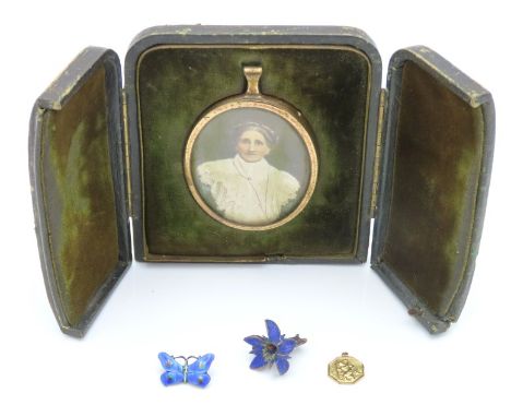 A 9ct gold St Christopher pendant 0.6g, a J. A. & S silver enamelled butterfly brooch, a carved floral wooden brooch & a fram