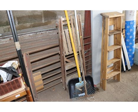 A quantity of long handled garden tools to include rakes, shovel, broom together with a set of wooden folding steps