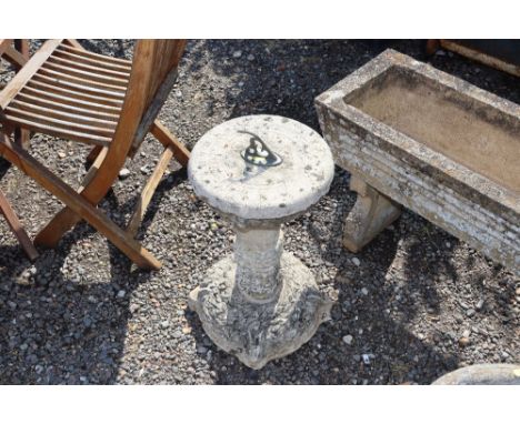 A concrete sundial on stand