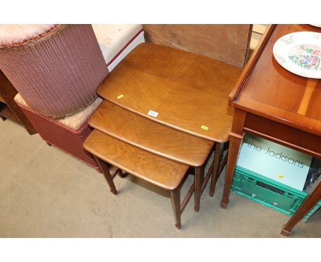 A nest of three Ercol style tables
