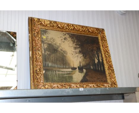 A gilt frame print depicting barges on a canal