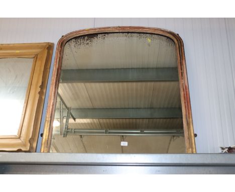 A large gilt framed over-mantel mirror