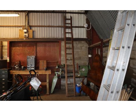 A wooden double extending ladder