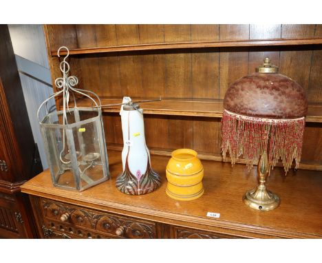 A table lamp with glass shade lacking lead, a part glazed table lamp and hanging candle lantern etc.