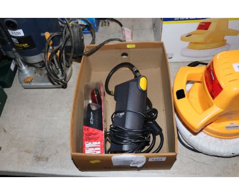 An AIRMAN 12v multi purpose air pump with a bicycle lock and key and a Cateye front and rear bicycle light