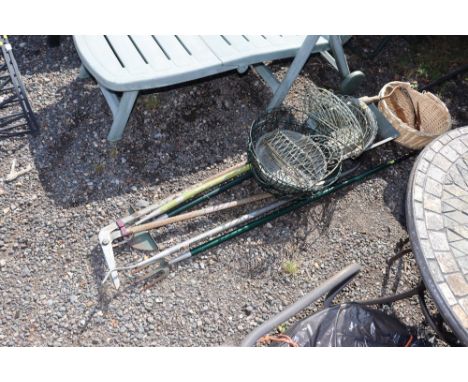 A quantity of long handled garden tools, various wire plant baskets, wooden trug etc.