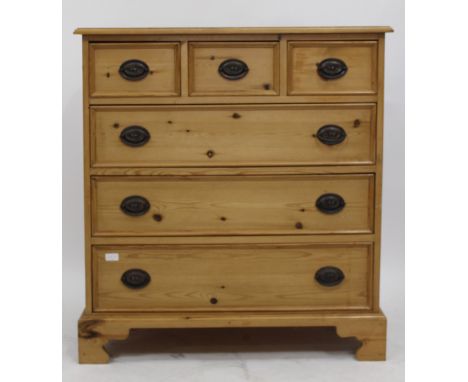 A MODERN PINE CHEST OF THREE SHORT AND THREE LONG DRAWERS raised on bracket feet, 92cm wide 