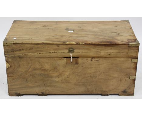 A PINE CABIN TRUNK with brass metal mounts and plaque with brass handles