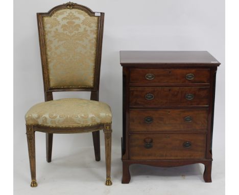 A SMALL MAHOGANY CHEST OF FOUR GRADUATED DRAWERS with fretwork decorated canted corners and standing on bracket feet, 60cm wi