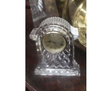 A WATERFORD CUT GLASS TIMEPIECE with electric movement together with an old miners lamp, two brass vases, a further brass vas