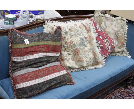 TWO FRENCH STYLE NEEDLEPOINT TAPESTRY CUSHIONS with tasselled edges depicting Cupid and another of a bouquet of flowers, a ke