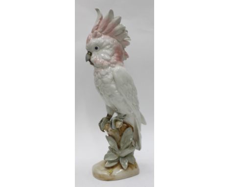 A ROYAL DUX CERAMIC MODEL OF A PARROT, with triangular mark to base, 41cm high