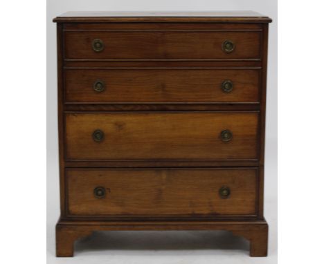 A GEORGIAN STYLE MAHOGANY CHEST OF FOUR GRADUATED DRAWERS with ring turned handles and standing on bracket feet, 66cm wide x 