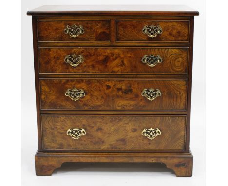 A BURR WALNUT VENEERED GEORGIAN STYLE CONTEMPORARY CHEST OF TWO SHORT AND THREE LONG DRAWERS standing on bracket feet, 76cm w