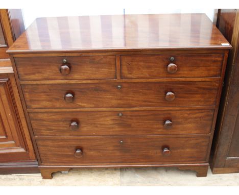 A 19TH CENTURY MAHOGANY CHEST OF TWO SHORT AND THREE LONG DRAWERS with turned knob handles and standing on bracket feet, 123c