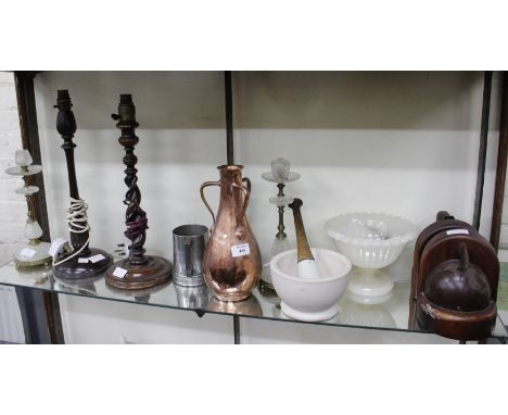 AN OLD COPPER VASE with three handles, two wooden table lamps, a ceramic pestle and mortar and further decorative items