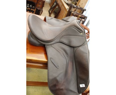A LEATHER HORSE RIDING SADDLE by 'The Saddle Company' and another leather riding saddle together with a bridle, three shootin