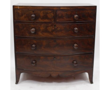 A BOW FRONT FLAME MAHOGANY TWO OVER THREE DRAWER CHEST on splay bracket feet, 104cm high x 50cm deep x 104cm wide