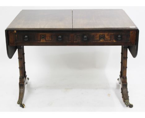 A GEORGIAN MAHOGANY SOFA TABLE with drop leaves to either end, each with ruled joints, the twin frieze drawers with Greek key