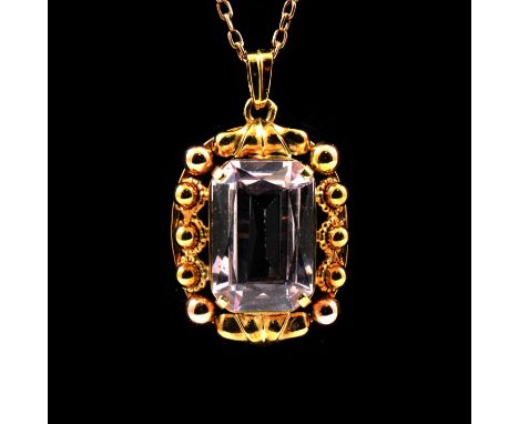 Three gemset pendants and chains, an emerald cut synthetic pink stone claw set in a yellow metal mount 25x20mm, on a rectangu