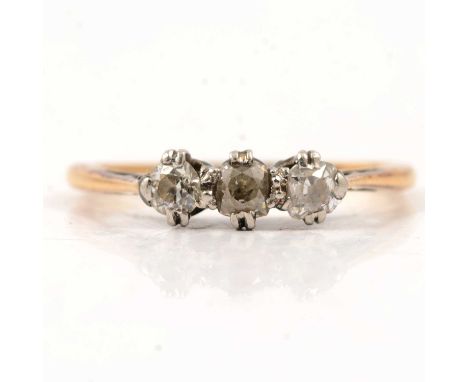 A diamond three stone ring, the old cut stones claw set in a traditional three stone mount marked 18ct, ring size M, gross we