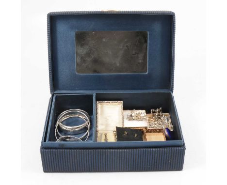 A jewellery box named Christian Dior Parfums with an enamel fob watch and silver jewellery, the 27mm fob watch having a white