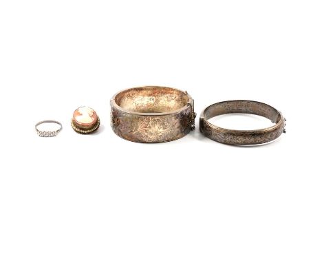 Two silver half hinged bangles, one 25mm wide with engraved pattern to front, Birmingham 1963, the other similar bangle 14mm 