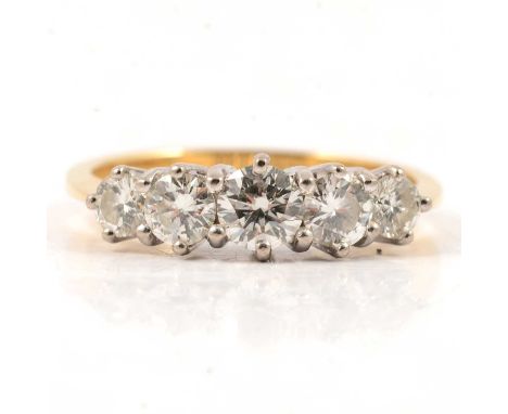 A diamond five stone ring, the brilliant cut diamonds graduating from 3.5mm to 4.8mm, claw set in an 18 carat yellow and whit