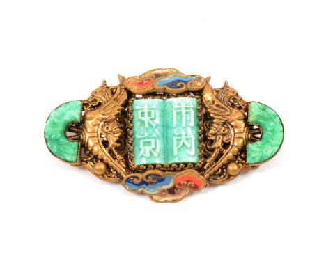 A brooch influenced by The Chinese Art Exhibition of 1935-1936, probably Max Neiger of Gablonz, a gilt metal brooch set with 