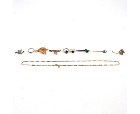 A collection of white metal and gold-plated jewellery, a tie bar with green stone; a cats eye ring; gold-plated leaf spray br