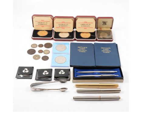 A collection of Commemorative coins, three Pobjoy Mint silver-gilt Commemorative Crowns to commemorate the visit of Queen Eli
