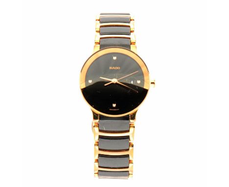 Rado - a lady's wristwatch, a 22mm circular black dial with quarterly diamond markers and date aperture in a 27mm gold-plated