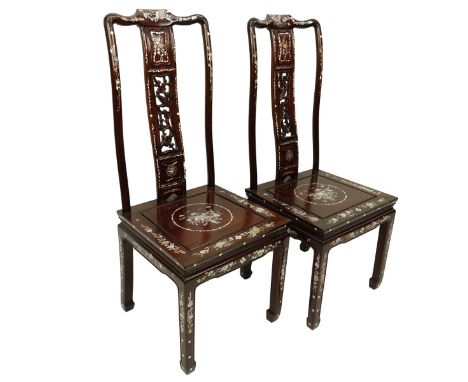 Pair of Chinese Mother of Pearl Inlaid Side Chairs. Flower motif with pierced backing. Measures 43" H x 18" W. Condition: One