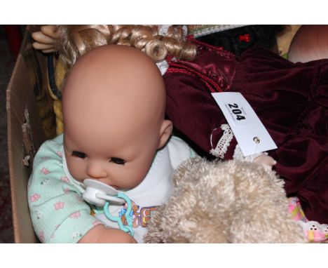 A mixed lot of collectors dolls and toys, to include a large kewpie doll, a realistic life-size baby doll and other similar d